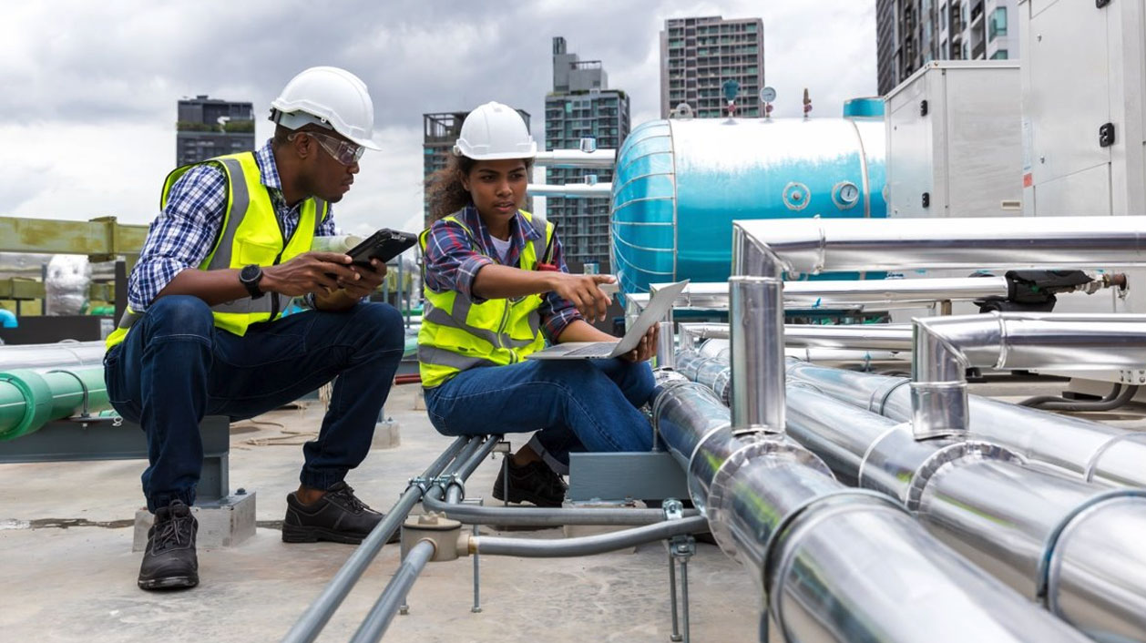 Engineers Conducting Site analysis, feasibility and due diligence in India by Inspecting Rooftop Industrial Equipment Engineers Conducting Site analysis, feasibility and due diligence in India by Inspecting Rooftop Industrial Equipment