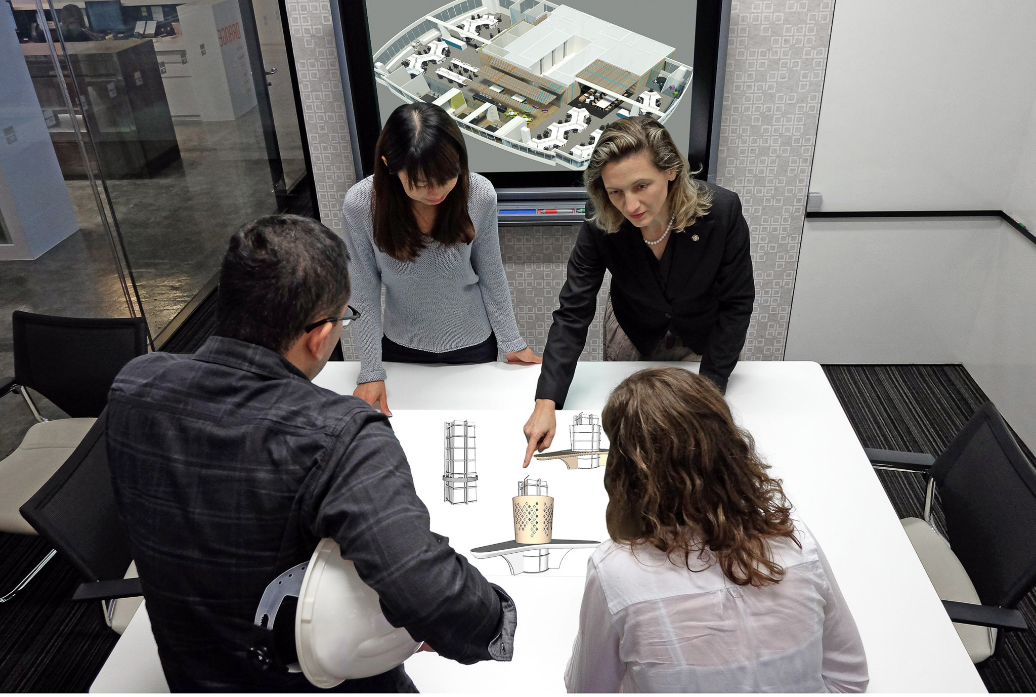 A group of professionals, including Dr. Christine Bruckner, engaged in a discussion around a table with architectural models and plans. The focus is on designing holistic integrated workplaces with ESG responsiveness, embodying sustainability and adaptability in building practices.